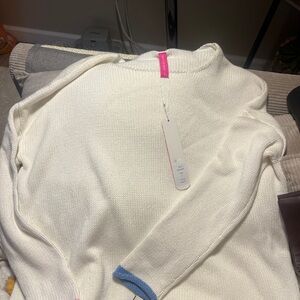 Elegant Cream Turtleneck Sweater with Blue Accents